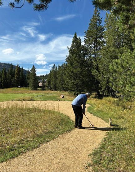 Whitney Peyton tees off at the Yellowstone Club Mountain Golf course